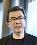 越塚登氏